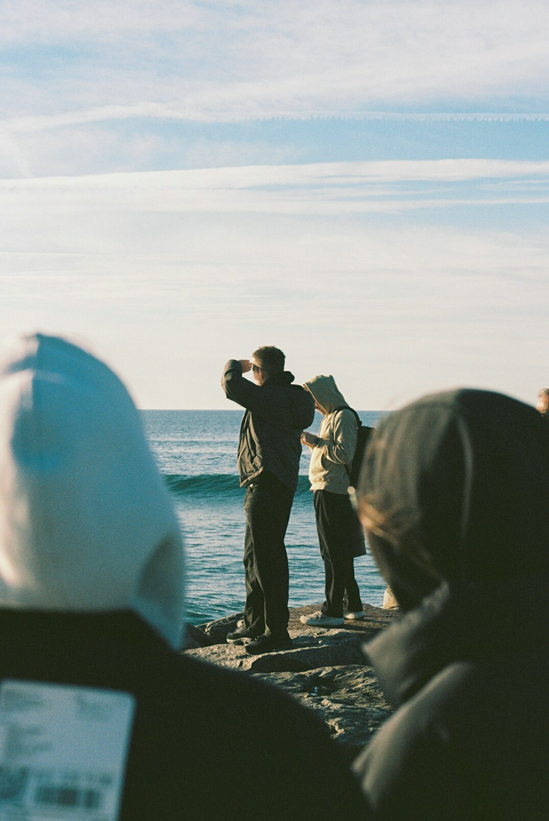 Small team of storytellers and photographers standing together outdoors